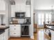 Kitchen nook featuring stainless steel beverage cooler and white cabinets at 150 E 46Th St, Indianapolis, IN 46205