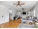 Inviting living room with built-in shelving, ceiling fans, and hardwood floors at 150 E 46Th St, Indianapolis, IN 46205