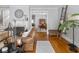 Inviting living room displaying a fireplace, hardwood floors, and a glimpse into the dining area at 150 E 46Th St, Indianapolis, IN 46205