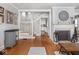 Inviting living room with fireplace, wood floors, and staircase at 150 E 46Th St, Indianapolis, IN 46205