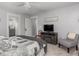 Well-lit main bedroom shows the en-suite bathroom and closet through open doors at 150 E 46Th St, Indianapolis, IN 46205