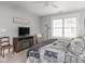 Comfortable main bedroom with sitting area and television, well lit by a large window at 150 E 46Th St, Indianapolis, IN 46205