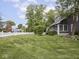 Expansive lawn and landscaping, enhanced by a charming white picket fence at 150 E 46Th St, Indianapolis, IN 46205