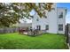 The backyard offers outdoor living space on the deck with seating and barbecue for summer enjoyment at 15264 Ten Point Dr, Noblesville, IN 46060
