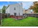 Fenced backyard with a spacious wooden deck, ideal for outdoor entertaining and relaxation at 15264 Ten Point Dr, Noblesville, IN 46060