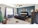 Primary bedroom with dark blue accent wall and king sized bed at 15264 Ten Point Dr, Noblesville, IN 46060