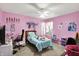 A bedroom with pink walls, and a ceiling fan, with toys and various decor at 15264 Ten Point Dr, Noblesville, IN 46060