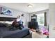 Bedroom with a dresser, TV, large bed and sports decor at 15264 Ten Point Dr, Noblesville, IN 46060
