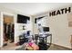 Bedroom with large HEATH lettering, a desk area with two monitors, and walk-in closet at 15264 Ten Point Dr, Noblesville, IN 46060