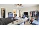 Bedroom featuring a ceiling fan, dark wood dresser, and a clothing rack at 15264 Ten Point Dr, Noblesville, IN 46060