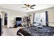 Bedroom with bed, black dresser and TV, and large window at 15264 Ten Point Dr, Noblesville, IN 46060