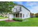 Well-kept two-story home with a two-car garage, a cozy front porch, and vibrant green lawn at 15264 Ten Point Dr, Noblesville, IN 46060