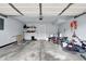 Attached garage featuring high ceilings, overhead door, shelving, and plenty of storage space at 15264 Ten Point Dr, Noblesville, IN 46060