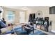 Inviting living area with contemporary decor, hardwood floors, and abundant natural light at 15264 Ten Point Dr, Noblesville, IN 46060