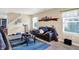 Relaxing living room with comfortable seating, soft lighting, and large windows for natural light at 15264 Ten Point Dr, Noblesville, IN 46060