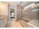Full bathroom showcasing tiled shower with a glass enclosure, bench, and coordinated hardware at 15675 Myland Dr, Noblesville, IN 46062