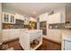 Gourmet kitchen features a central island, stainless steel appliances, and ample counter space at 15675 Myland Dr, Noblesville, IN 46062