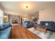 Bright living room boasts hardwood floors, stylish furniture, and an open floor plan at 15675 Myland Dr, Noblesville, IN 46062