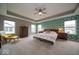 Spacious main bedroom suite featuring natural light, stylish furnishings, and walk-in closet at 15675 Myland Dr, Noblesville, IN 46062