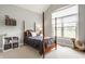 Cozy bedroom with a four-poster bed, large window, and soft carpet at 1820 N 1100 E, Sheridan, IN 46069