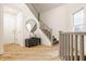 Entryway with staircase, hardwood floors, bench with pillows and modern decor at 1820 N 1100 E, Sheridan, IN 46069