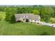 Areal view highlighting the house's exterior and showcasing the home's landscaping and driveway at 1820 N 1100 E, Sheridan, IN 46069
