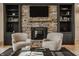 Detailed view of the stone fireplace with wooden mantle and custom built-in cabinets at 1820 N 1100 E, Sheridan, IN 46069