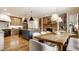Spacious open kitchen and dining area with modern appliances, a stone fireplace and hardwood floors at 1820 N 1100 E, Sheridan, IN 46069