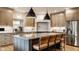 Well-appointed kitchen with a large island, stainless steel appliances, and modern lighting fixtures at 1820 N 1100 E, Sheridan, IN 46069