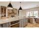 Modern kitchen with a large island, stainless steel appliances, and a view of the dining area at 1820 N 1100 E, Sheridan, IN 46069