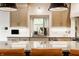 Bright kitchen featuring a stainless steel sink and appliances, with light-colored cabinets and tile backsplash at 1820 N 1100 E, Sheridan, IN 46069