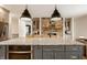 Open kitchen with a large center island, granite countertops, modern appliances and a stone fireplace at 1820 N 1100 E, Sheridan, IN 46069