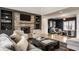 Comfortable living room with a stone fireplace, built-in shelving, and stylish decor at 1820 N 1100 E, Sheridan, IN 46069