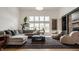 Bright living room with large windows, plush seating, and a stylish area rug at 1820 N 1100 E, Sheridan, IN 46069