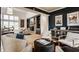 Bright, open living room with a stone fireplace, large windows, and comfortable seating arrangement at 1820 N 1100 E, Sheridan, IN 46069