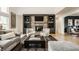 Inviting living room with a stone fireplace, built-in bookshelves, and comfortable seating at 1820 N 1100 E, Sheridan, IN 46069