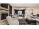 Open-concept living space with stone fireplace, and views into the dining area at 1820 N 1100 E, Sheridan, IN 46069