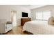 Bright and airy main bedroom with hardwood floors, a dresser, sitting area and a walk-in closet at 1820 N 1100 E, Sheridan, IN 46069