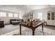 Spacious playroom with hardwood floors, ample seating, and bright natural lighting at 1820 N 1100 E, Sheridan, IN 46069