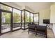 Relaxing sunroom featuring comfortable seating, view of backyard and a TV for entertainment at 1820 N 1100 E, Sheridan, IN 46069