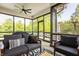 Relaxing screened in porch featuring comfortable seating and a view of the backyard at 1820 N 1100 E, Sheridan, IN 46069
