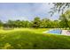 Aerial view of a lush green yard and beautiful in-ground pool, great for outdoor enjoyment at 1820 N 1100 E, Sheridan, IN 46069
