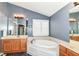 Bathroom featuring double sinks and a soaking tub at 18967 Mill Grove Dr, Noblesville, IN 46062