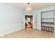 Open bonus room with tile flooring, storage, and hallway access at 18967 Mill Grove Dr, Noblesville, IN 46062