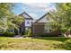 Beautiful two-story home featuring manicured landscaping, a brick facade and light-colored siding accents at 18967 Mill Grove Dr, Noblesville, IN 46062