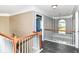 Upstairs hallway with gray paint, white railings, and a window with architectural interest at 18967 Mill Grove Dr, Noblesville, IN 46062