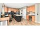 Bright kitchen features an island with seating, stainless steel appliances, and plenty of cabinet storage at 18967 Mill Grove Dr, Noblesville, IN 46062