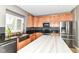 Modern kitchen featuring stainless steel appliances, granite countertops, and an island at 18967 Mill Grove Dr, Noblesville, IN 46062
