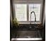 Stainless steel kitchen sink with a modern faucet and view of backyard at 18967 Mill Grove Dr, Noblesville, IN 46062