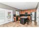 Updated kitchen boasts granite counters, stainless appliances, tiled backsplash, and a large island with seating at 18967 Mill Grove Dr, Noblesville, IN 46062